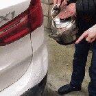 Fixing a car dent with hot water