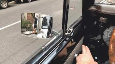 Car power window switch disguised as an old-timey manual crank window handle.