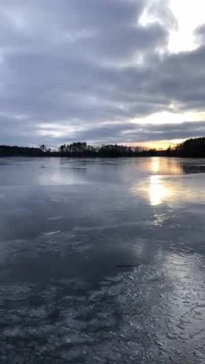 The sound of this ice chunk shattering on a frozen lake