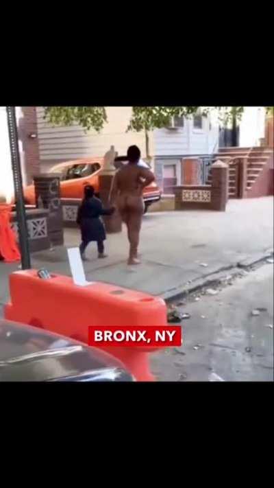 Naked woman walks daughter to school