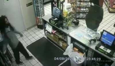 Cashier makes himself ready after seeing a suspicious guy outside his shop.