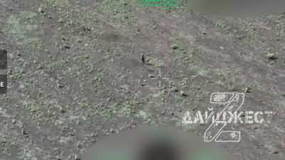 Two Russian soldiers in an empty field are attacked by several FPV drones but seem to survive every strike