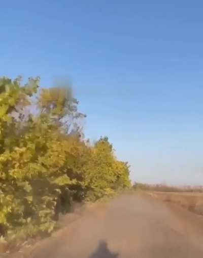 First person view of Russian biker nearly getting hit by Ukrainian FPV