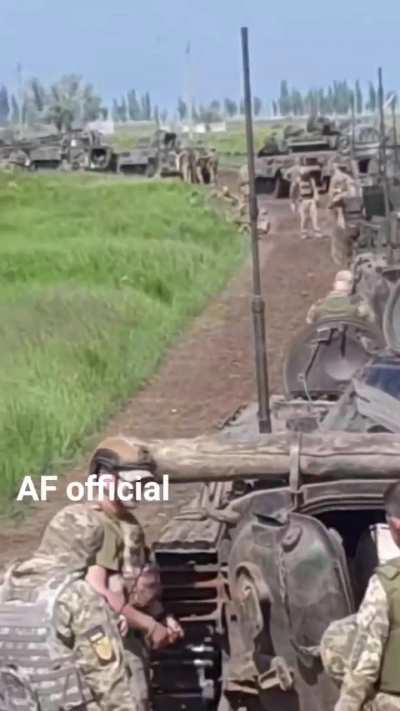 Ukrainian column of BMP-1 IFVs on a dirt road.