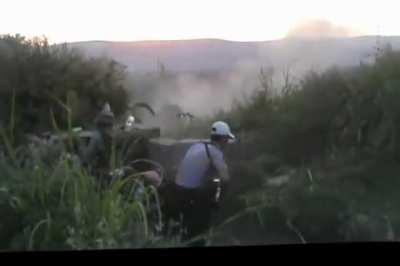 Early FSA fighters exchange fire with an SAA column using small arms and RPGs - Jisr al-Shughur - 9/5/2012