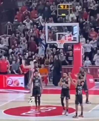 Serbian priest trying to distract ASVEL player during free throws on Euroleague match.