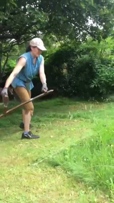 Cutting grass with a scythe