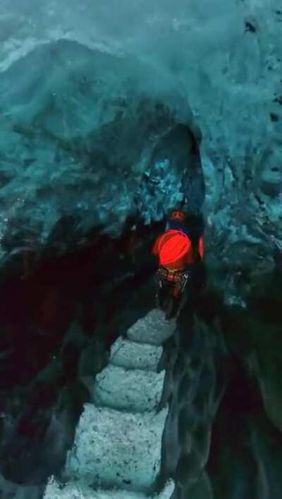 Walking through an ice cave on a glacier