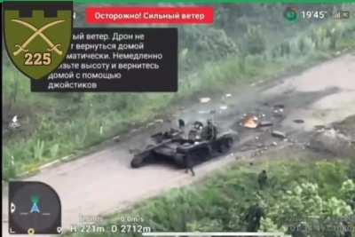 Russian tank drives into mines that were placed on top of the asphalt road