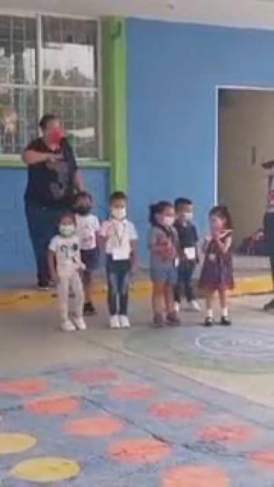 Kids in school literally salute/greet their parents when asked to salute the flag (&quot;saludar, ya.&quot;)