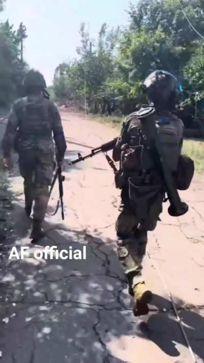 Ukrainian infantry on patrol, with dog.