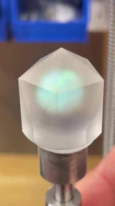 Cutting a D20 from a synthetic opal encased in glass