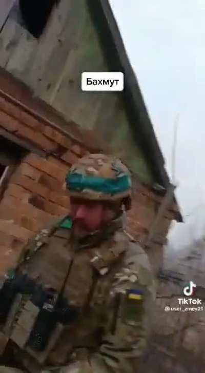 Ukrainian infantry in Bakhmut suburbs in engagement with a BTR-4 giving fire support