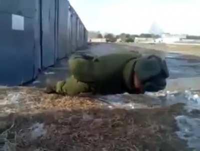 Russian soldier performs No-hand push-ups