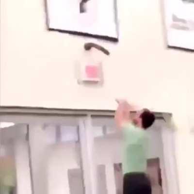 An absolute classic. Desperately trying to get this massive dildo off from school gym's wall