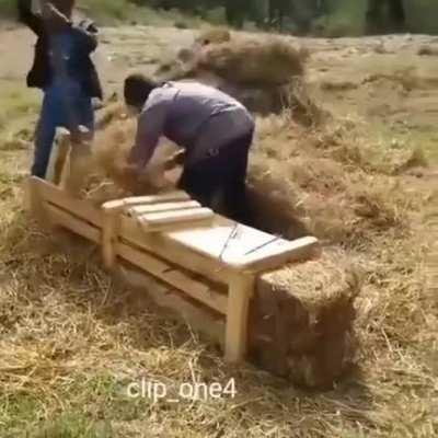 Making hay bales manually.