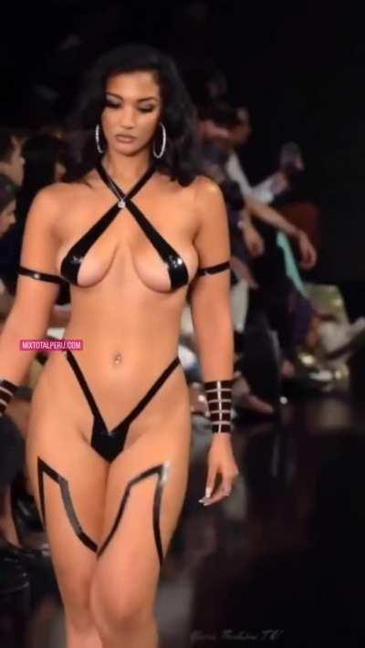 Model on stage with stripes cover tits and ass