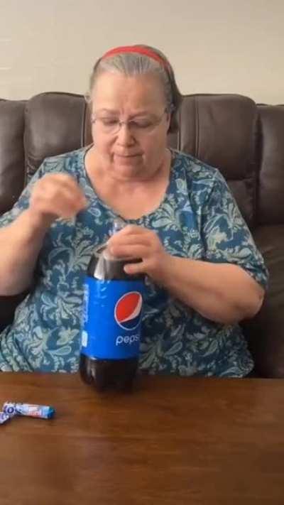 An innocent old lady testing the coke - mentos experiment