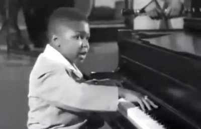 Self-taught, child prodigy piano player, Sugar Chile Robinson (1951)