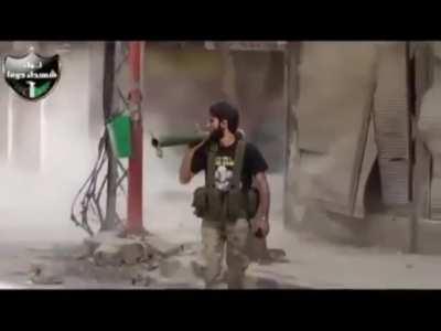 Syrian rebel acts like he's in an action movie as a tank targets his position (April 2013)