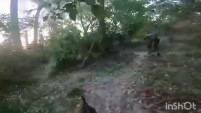 Russian catches mine/grenade after Ukrainian ambush.