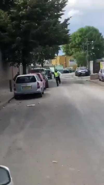 Riot police gets sprayed in car wash