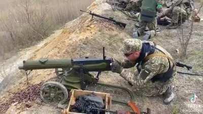 Ukrainian solider target practices with WW1 Maxim gun.