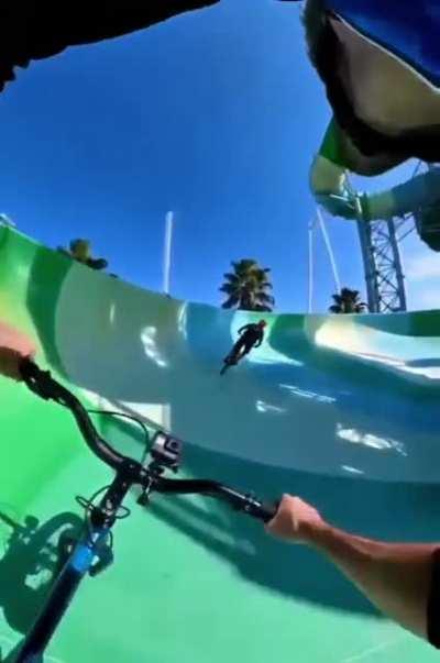 Biking down the water slide