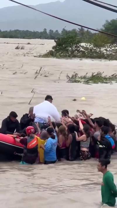 Self-serving and narcissistic politician waving and giving &quot;bread crumb donations&quot; to victims of a recent typhoon.