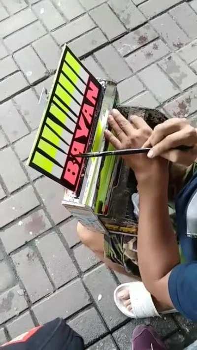 This guy painting a little sign