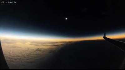 Flying in a plane during a Solar eclipse. It looks so fascinating