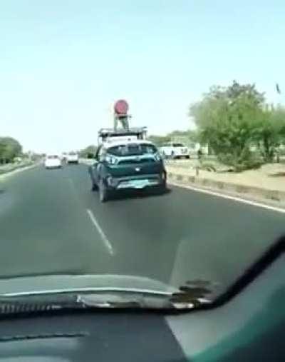 Electric car in India with windmill on top