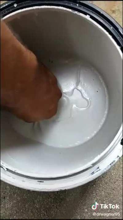 Peeling a paint can.