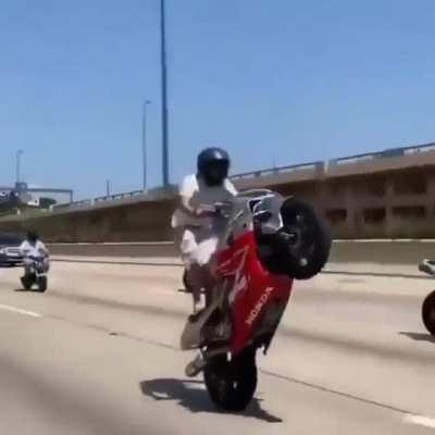 Face planting on the highway after doing a wheelie