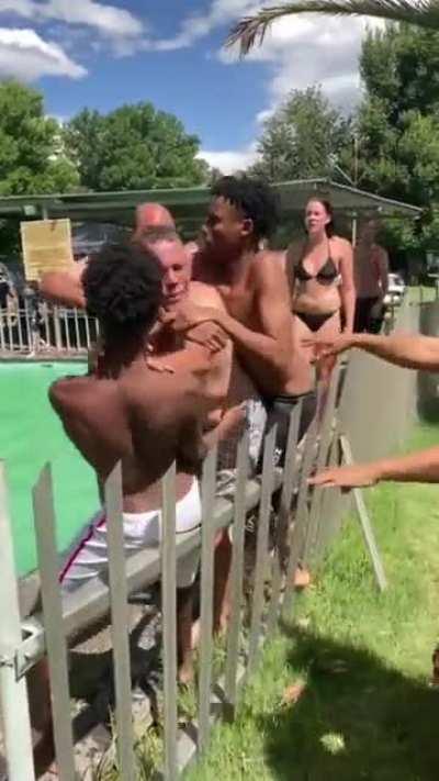 Racist old white man fighting with black kids because they are apparently not allowed in the pool as it's reserved for the &quot;white people&quot;. Occured in South Africa.