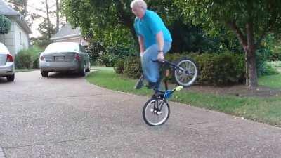 Grandpa still got it and able to do some neat tricks riding on a bmx