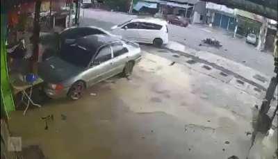 Bike plows in car making u-turn. (Malaysia)