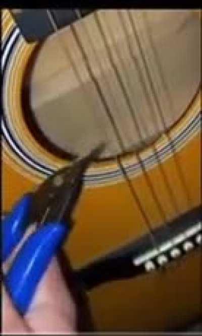 Breaking a guitar string