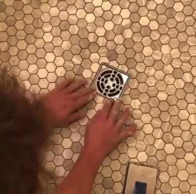 Laying that last piece of tile just perfectly.