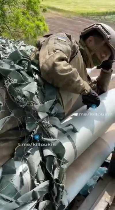 Ukrainian trooper cuddles some shells bro