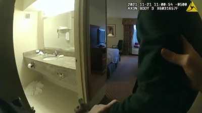 man tries to escape the police in a hotel room