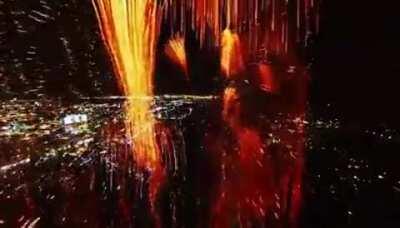 A drone flying through fireworks