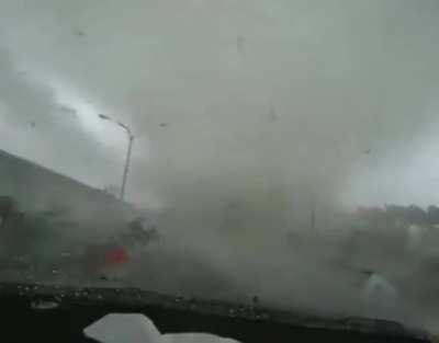 Tornado forms on car while driving