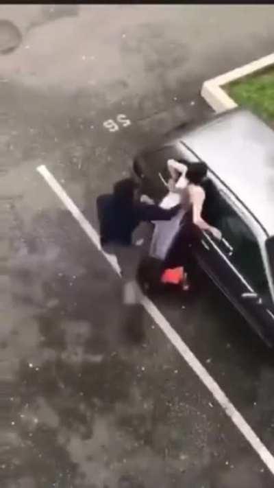 Angry woman attacks a car with knife and hammer, gets taken out by a dude