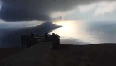 Time lapse of clouds traveling towards the shore on lake Michigan.