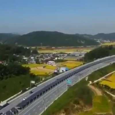 In South Korea, the solar panels in the middle of the highway have a bicycle path underneath..cyclists are protected from the sun, isolated from traffic, and the country can produce clean energy.