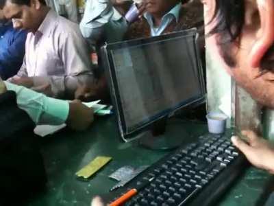 Receptionist at a busy pharmacy in India