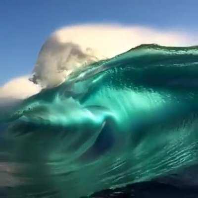 The different shades of blue are beautiful in this wave