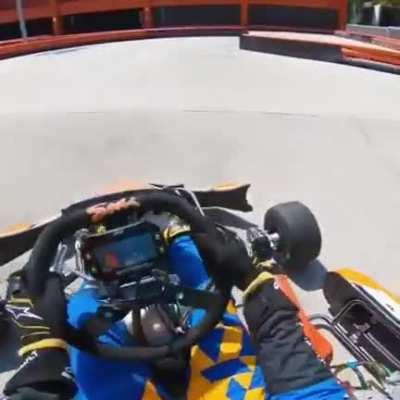 Carlos Sainz, an F1 driver, have a go in a go kart.