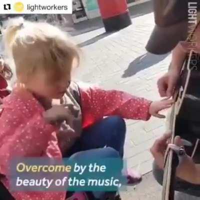 Blind autistic girl meets busker